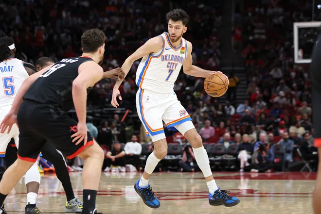 Jan 15, 2026; Houston, Texas, USA; Oklahoma City Thunder center Chet Holmgren (7) dribbles the ball during the third quarter against the Houston Rockets at Toyota Center. Mandatory Credit: Troy Taormina-Imagn Images