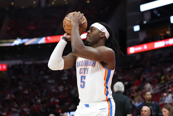 Jan 15, 2026; Houston, Texas, USA; Oklahoma City Thunder guard Luguentz Dort (5) shoots the ball during the third quarter against the Houston Rockets at Toyota Center. Mandatory Credit: Troy Taormina-Imagn Images