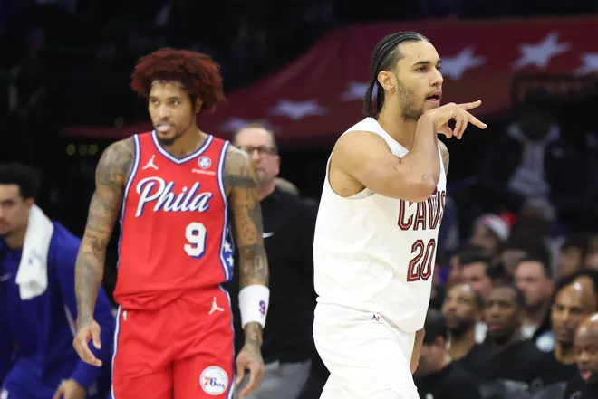 Jan 16, 2026; Philadelphia, Pennsylvania, USA; Cleveland Cavaliers guard Jaylon Tyson (20) reacts in front of Philadelphia 76ers guard Kelly Oubre Jr. (9) after his three pointer during the second quarter at Xfinity Mobile Arena. Mandatory Credit: Bill Streicher-Imagn Images
