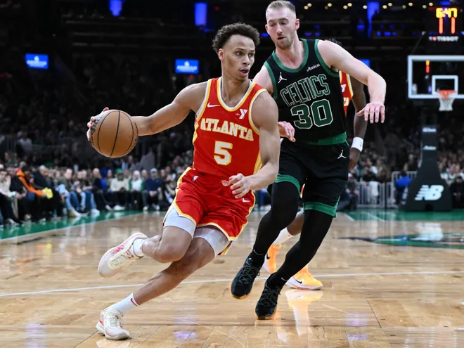 Jan 18, 2025; Boston, Massachusetts, USA; Atlanta Hawks guard Dyson Daniels (5) drives to the basket against Boston Celtics forward Sam Hauser (30) during the second quarter at the TD Garden. Mandatory Credit: Brian Fluharty-Imagn Images