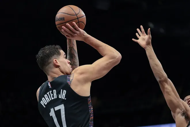 Jan 16, 2026; Brooklyn, New York, USA; Brooklyn Nets forward Michael Porter Jr. (17) shoots the ball against the Chicago Bulls during the first quarter at Barclays Center.Vincent Carchietta-Imagn Images