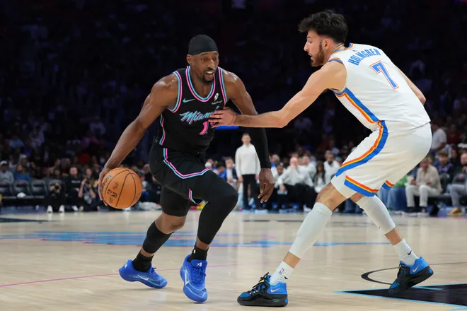 Jan 17, 2026; Miami, Florida, USA; Miami Heat center Bam Adebayo (13) drives to the basket against Oklahoma City Thunder center Chet Holmgren (7) during the third quarter at Kaseya Center. Mandatory Credit: Sam Navarro-Imagn Images