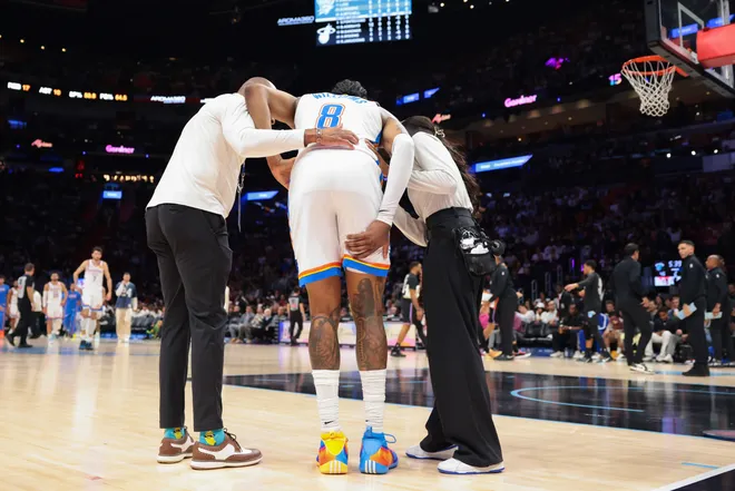 Jan 17, 2026; Miami, Florida, USA; Oklahoma City Thunder guard Jalen Williams (8) is helped off the court after a leg injury against the Miami Heat during the second quarter at Kaseya Center. Mandatory Credit: Sam Navarro-Imagn Images