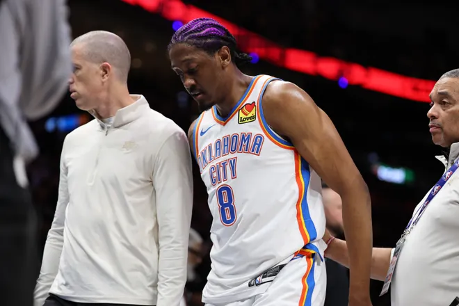 MIAMI, FLORIDA - JANUARY 17: Jalen Williams #8 of the Oklahoma City Thunder is helped off the court against the Miami Heat during the first half at Kaseya Center on January 17, 2026 in Miami, Florida. NOTE TO USER: User expressly acknowledges and agrees that, by downloading and or using this photograph, User is consenting to the terms and conditions of the Getty Images License Agreement. (Photo by Carmen Mandato/Getty Images)