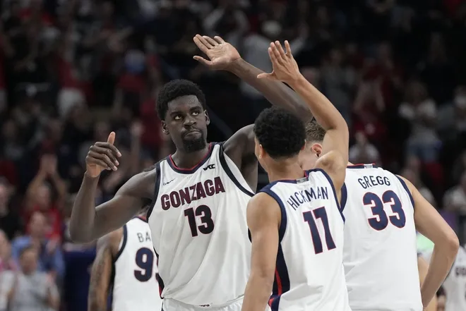 March 10, 2025; Las Vegas, NV, USA; Gonzaga Bulldogs forward Graham Ike (13) celebrates with guard Nolan Hickman (11) against the San Francisco Dons during the second half in the semifinal of the West Coast Conference tournament at Orleans Arena.