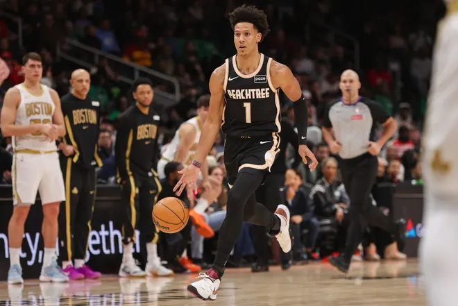 Jan 17, 2026; Atlanta, Georgia, USA; Atlanta Hawks forward Jalen Johnson (1) dribbles against the Boston Celtics in the first quarter at State Farm Arena. Mandatory Credit: Brett Davis-Imagn Images