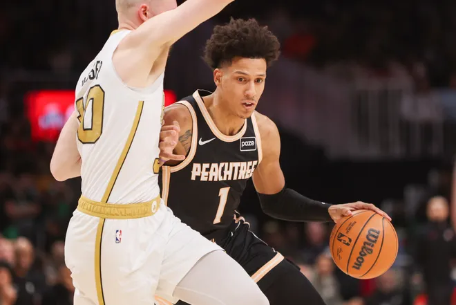 Jan 17, 2026; Atlanta, Georgia, USA; Atlanta Hawks forward Jalen Johnson (1) dribbles against the Boston Celtics in the second quarter at State Farm Arena. Mandatory Credit: Brett Davis-Imagn Images