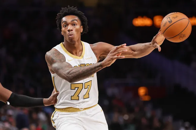 Jan 17, 2026; Atlanta, Georgia, USA; Boston Celtics forward Amari Williams (77) passes the ball against the Atlanta Hawks in the fourth quarter at State Farm Arena. Mandatory Credit: Brett Davis-Imagn Images