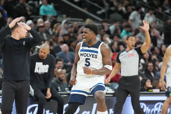 Jan 17, 2026; San Antonio, Texas, USA; Minnesota Timberwolves guard Anthony Edwards (5) reacts toward the San Antonio Spurs bench in the second half at Frost Bank Center. Mandatory Credit: Daniel Dunn-Imagn Images