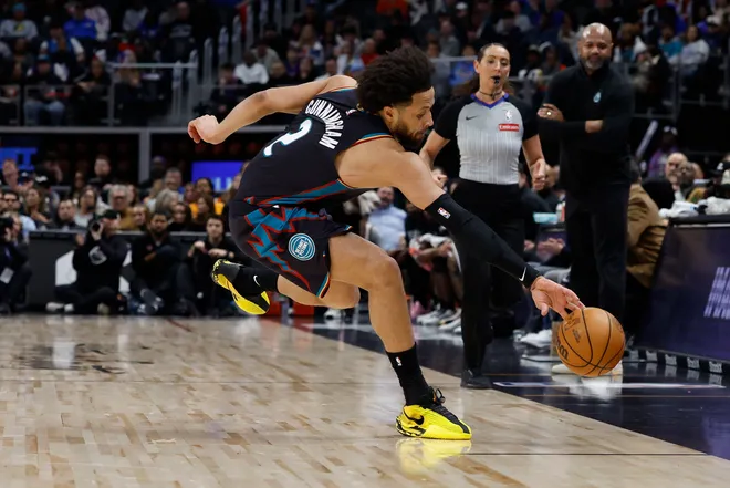 Jan 17, 2026; Detroit, Michigan, USA; Detroit Pistons guard Cade Cunningham (2) saves the ball in the first half against the Indiana Pacers at Little Caesars Arena. Mandatory Credit: Rick Osentoski-Imagn Images