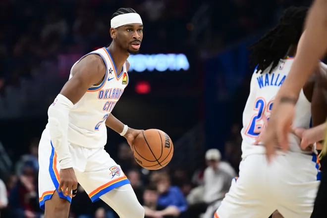 Jan 19, 2026; Cleveland, Ohio, USA; Oklahoma City Thunder guard Shai Gilgeous-Alexander (2) brings the ball up court during the first half against the Cleveland Cavaliers at Rocket Arena. Mandatory Credit: Ken Blaze-Imagn Images