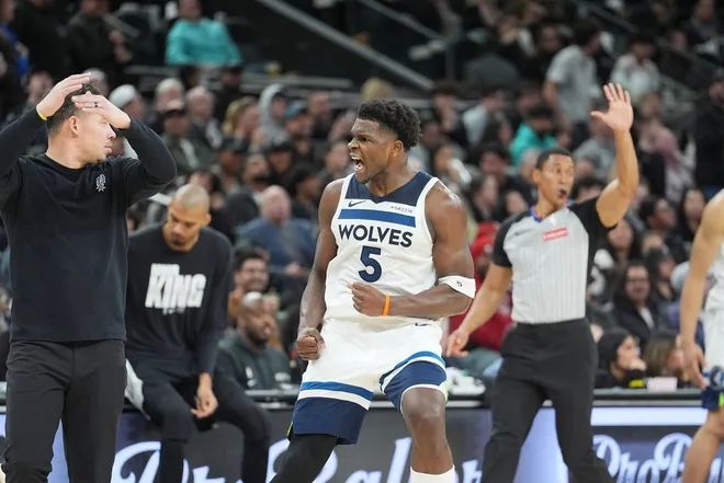 Jan 17, 2026; San Antonio, Texas, USA; Minnesota Timberwolves guard Anthony Edwards (5) reacts toward the San Antonio Spurs bench in the second half at Frost Bank Center.
