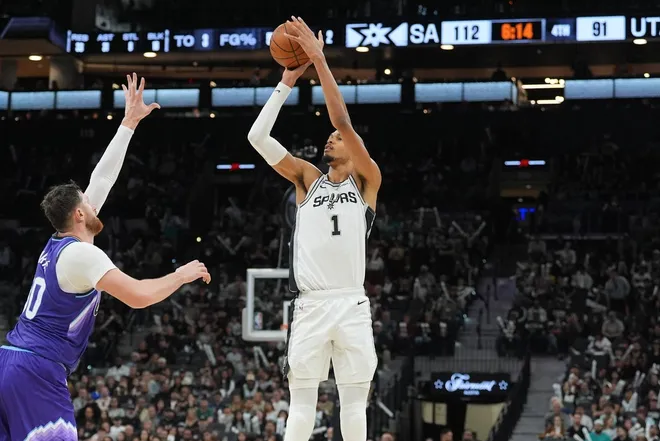 Jan 19, 2026; San Antonio, Texas, USA; San Antonio Spurs forward Victor Wembanyama (1) shoots the ball against Utah Jazz center Jusuf Nurkic (30) during the second half at Frost Bank Center.