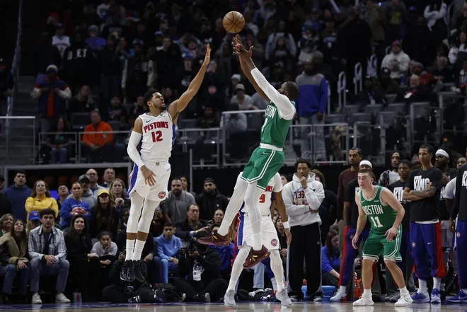 Jan 19, 2026; Detroit, Michigan, USA; Boston Celtics guard Jaylen Brown (7) shoots the ball against Detroit Pistons forward Tobias Harris (12) in the second half at Little Caesars Arena.