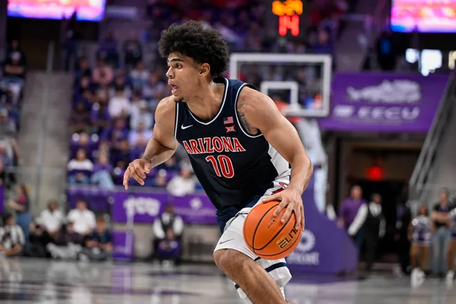 Jan 10, 2026; Fort Worth, Texas, USA; Arizona Wildcats forward Koa Peat (10) brings the ball up court during the game between the Horned Frogs and the Wildcats at Ed and Rae Schollmaier Arena. Mandatory Credit: Jerome Miron-Imagn Images