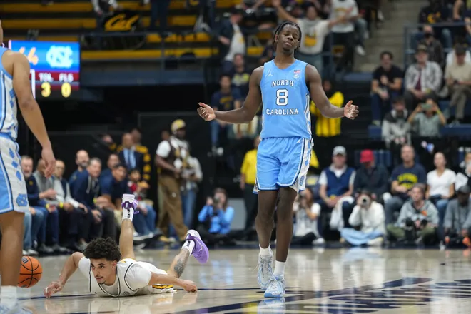 Jan 17, 2026; Berkeley, California, USA; North Carolina Tar Heels forward Caleb Wilson (8) reacts after being called for a foul against California Golden Bears guard Justin Pippen (on ground left) during the second half at Haas Pavilion. Mandatory Credit: Darren Yamashita-Imagn Images