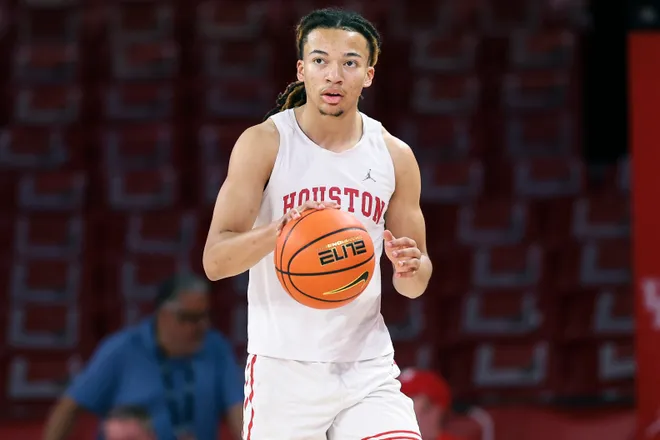 Jan 6, 2026; Houston, Texas, USA; Houston Cougars guard Kingston Flemings (4) warms up before the game against the Texas Tech Red Raiders at Fertitta Center. Mandatory Credit: Troy Taormina-Imagn Images