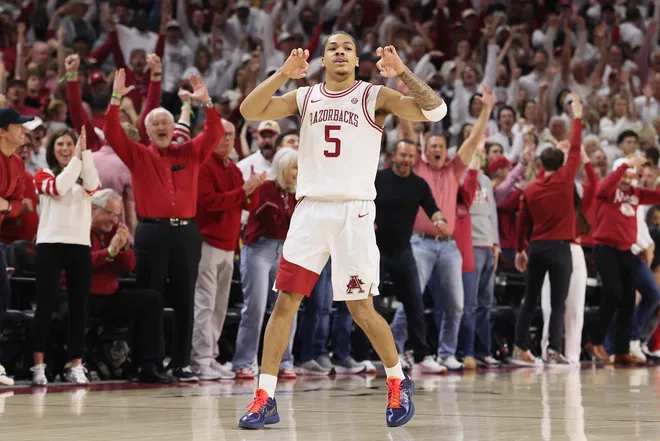 Jan 3, 2026; Fayetteville, Arkansas, USA; Arkansas Razorbacks guard Darius Acuff Jr (5) gestures after making a three point shot against the Tennessee Volunteers during the second half at Bud Walton Arena. Mandatory Credit: Nelson Chenault-Imagn Images