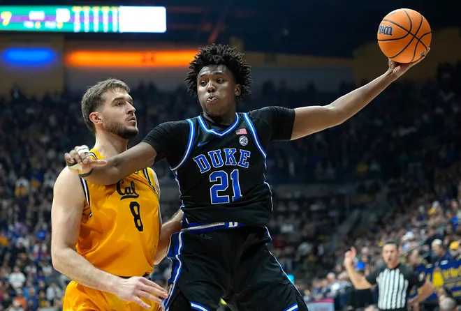 BERKELEY, CALIFORNIA - JANUARY 14: Patrick Ngongba II #21 of the Duke Blue Devils is guarded by Milos Ilic #8 of the California Golden Bears in the first half at Haas Pavilion on January 14, 2026 in Berkeley, California. (Photo by Thearon W. Henderson/Getty Images)