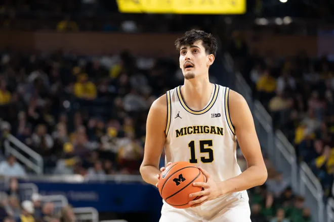 ANN ARBOR, MICHIGAN - DECEMBER 21: Aday Mara #15 of the Michigan Wolverines shoots a free throw during the first half against the La Salle Explorers at Crisler Arena on December 21, 2025 in Ann Arbor, Michigan. (Photo by Jaime Crawford/Getty Images)