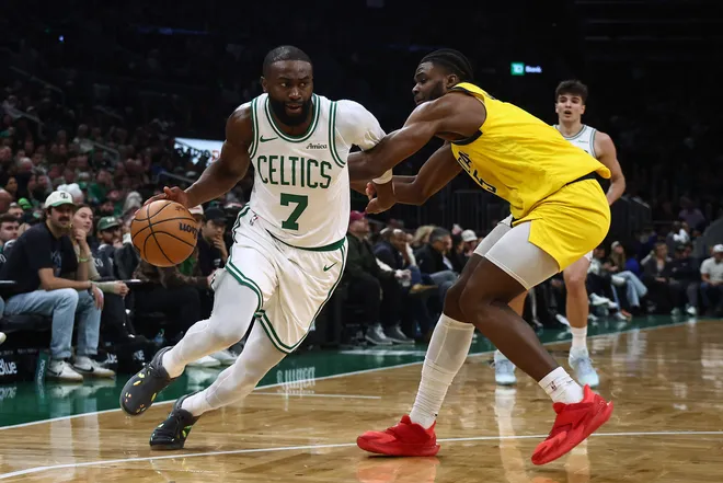 Jan 21, 2026; Boston, Massachusetts, USA; Boston Celtics guard Jaylen Brown (7) drives on Indiana Pacers forward Jarace Walker (5) during the second quarter at TD Garden. Mandatory Credit: Winslow Townson-Imagn Images
