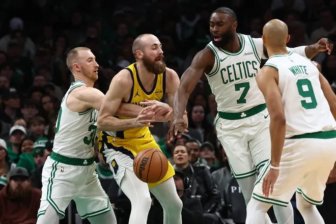 Jan 21, 2026; Boston, Massachusetts, USA; Boston Celtics forward Sam Hauser (30) and guard Jaylen Brown (7) combine to knock the ball away from Indiana Pacers center Jay Huff (32) during the second quarter at TD Garden. Mandatory Credit: Winslow Townson-Imagn Images