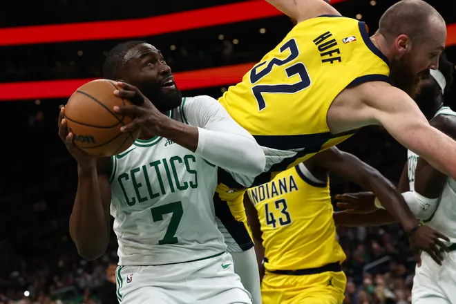 Jan 21, 2026; Boston, Massachusetts, USA; Indiana Pacers center Jay Huff (32) tumbles over Boston Celtics guard Jaylen Brown (7) during the first quarter at TD Garden. Mandatory Credit: Winslow Townson-Imagn Images