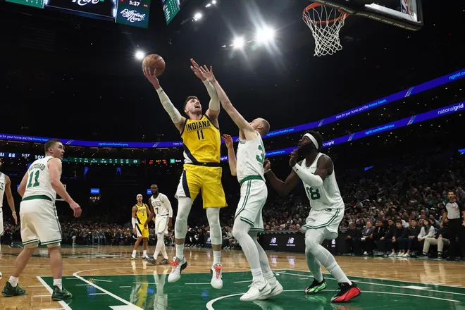 Jan 21, 2026; Boston, Massachusetts, USA; Indiana Pacers forward Micah Potter (11) shoots against Boston Celtics forward Sam Hauser (30) during the second half at TD Garden. Mandatory Credit: Winslow Townson-Imagn Images