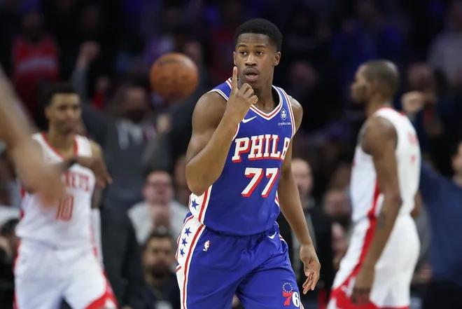 Jan 22, 2026; Philadelphia, Pennsylvania, USA; Philadelphia 76ers guard Vj Edgecombe (77) reacts after a score Houston Rockets during overtime at Xfinity Mobile Arena.