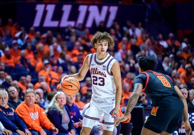 Jan 21, 2026; Champaign, Illinois, USA; Illinois Fighting Illini guard Keaton Wagler (23) brings the ball up against Maryland Terrapins guard David Coit (8) in the first half at State Farm Center. Mandatory Credit: Fred Zwicky-Imagn Images