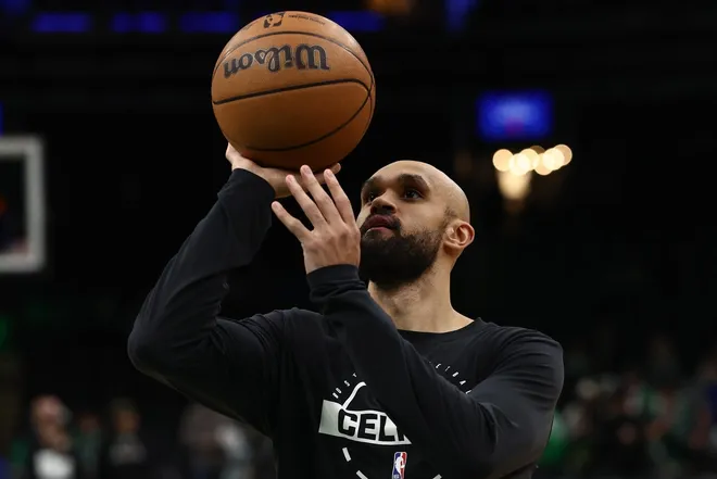 Jan 21, 2026; Boston, Massachusetts, USA; Boston Celtics guard Derrick White (9) shoots before their game against the Indiana Pacers at TD Garden.