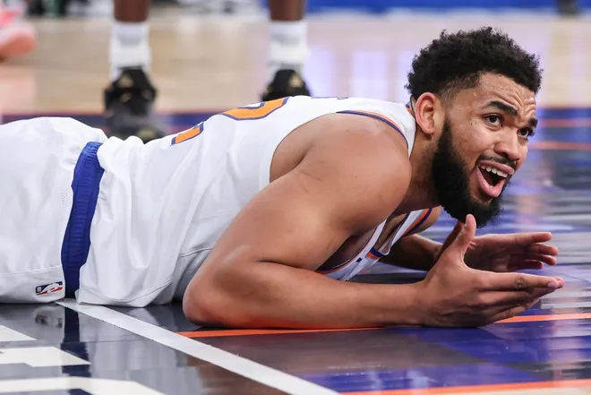 Jan 21, 2026; New York, New York, USA; New York Knicks center Karl-Anthony Towns (32) reacts after getting called for an offensive foul in the second quarter against the Brooklyn Nets at Madison Square Garden.
