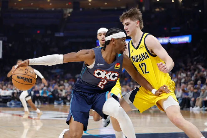 Jan 23, 2026; Oklahoma City, Oklahoma, USA; Oklahoma City Thunder guard Shai Gilgeous-Alexander (2) is defended by Indiana Pacers guard Johnny Furphy (12) on a drive during the second quarter at Paycom Center. Mandatory Credit: Alonzo Adams-Imagn Images