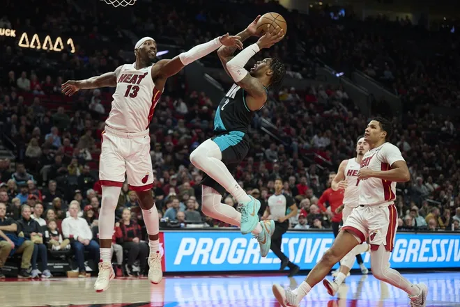 Jan 22, 2026; Portland, Oregon, USA; Portland Trail Blazers guard Caleb Love (2) drives to the basket during the first half against Miami Heat center Bam Adebayo (13) at Moda Center.