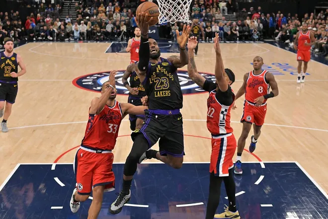 Jan 22, 2026; Inglewood, California, USA; Los Angeles Lakers forward LeBron James (23) drives past Los Angeles Clippers forward Nicolas Batum (33) and guard Jordan Miller (22) for a basket in the second half at Intuit Dome.