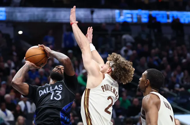 Jan 22, 2026; Dallas, Texas, USA; Dallas Mavericks forward Naji Marshall (13) shoots as Golden State Warriors guard Brandin Podziemski (2) defends during the second half at American Airlines Center.