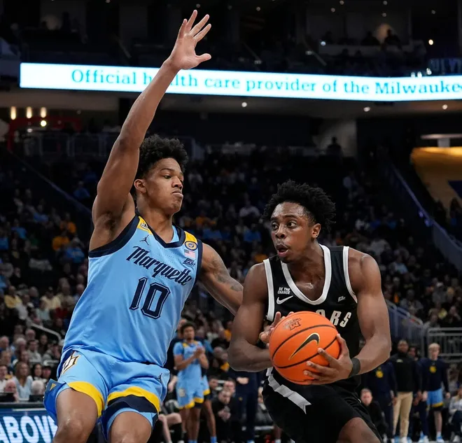 Marquette Golden Eagles forward Damarius Owens (10) attempts to block Providence Friars guard Jayden Pierre (1) during the second half of the game on Tuesday February 25, 2025 at Fiserv Forum in Milwaukee, Wis.