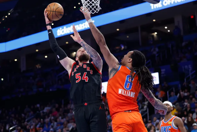 Jan 25, 2026; Oklahoma City, Oklahoma, USA; Toronto Raptors forward/center Sandro Mamukelashvili (54) goes up for a basket as Oklahoma City Thunder forward Jaylin Williams (6) defends during the second half at Paycom Center. Mandatory Credit: Alonzo Adams-Imagn Images