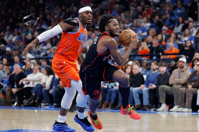 Jan 25, 2026; Oklahoma City, Oklahoma, USA; Toronto Raptors guard Immanuel Quickley (5) drives to the basket around Oklahoma City Thunder guard Luguentz Dort (5) during the second half at Paycom Center. Mandatory Credit: Alonzo Adams-Imagn Images