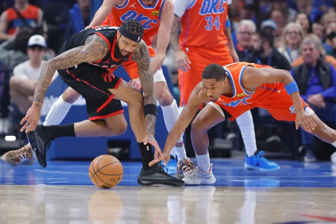 Jan 25, 2026; Oklahoma City, Oklahoma, USA; Toronto Raptors forward Brandon Ingram (3) and Oklahoma City Thunder guard Aaron Wiggins (21) reach for a loose ball during the first quarter at Paycom Center. Mandatory Credit: Alonzo Adams-Imagn Images
