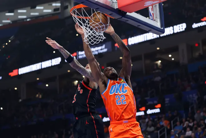 Jan 25, 2026; Oklahoma City, Oklahoma, USA; Oklahoma City Thunder guard Cason Wallace (22) dunks in front of Toronto Raptors forward Brandon Ingram (3) during the first quarter at Paycom Center. Mandatory Credit: Alonzo Adams-Imagn Images