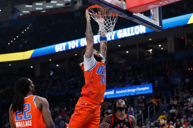 Jan 25, 2026; Oklahoma City, Oklahoma, USA; Oklahoma City Thunder guard/forward Kenrich Williams (34) dunks against the Toronto Raptors during the second quarter at Paycom Center. Mandatory Credit: Alonzo Adams-Imagn Images