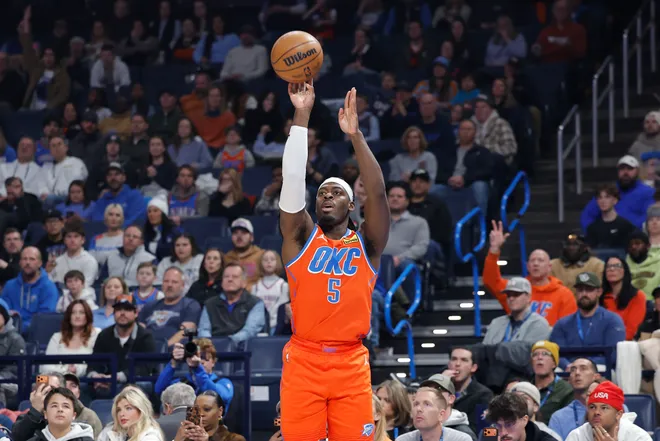 Jan 25, 2026; Oklahoma City, Oklahoma, USA; Oklahoma City Thunder guard Luguentz Dort (5) shoots a three point basket against the Toronto Raptors during the first quarter at Paycom Center. Mandatory Credit: Alonzo Adams-Imagn Images
