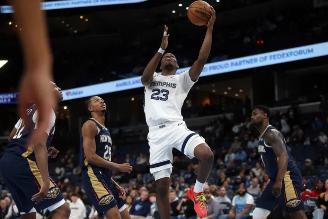 Jan 23, 2026; Memphis, Tennessee, USA; Memphis Grizzlies forward Cedric Coward (23) drives to the basket during the fourth quarter against the New Orleans Pelicans at FedExForum.