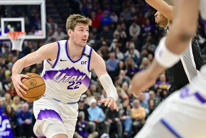 Jan 22, 2026; Salt Lake City, Utah, USA; Utah Jazz center Kyle Filipowski (22) dribbles during the second half against the San Antonio Spurs at Delta Center.