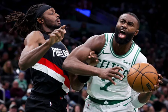 BOSTON, MA - JANUARY 26: Jaylen Brown #7 of the Boston Celtics drives against Jerami Grant #9 of the Portland Trail Blazers in the fourth quarter at TD Garden on January 26, 2026 in Boston, Massachusetts. NOTE TO USER: User expressly acknowledges and agrees that, by downloading and or using this photograph, User is consenting to the terms and conditions of the Getty Images License Agreement. (Photo by Adam Glanzman/Getty Images)