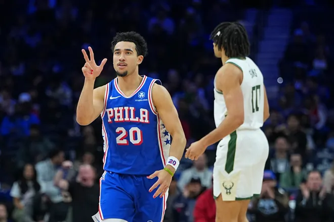 PHILADELPHIA, PENNSYLVANIA - JANUARY 27: Jared McCain #20 of the Philadelphia 76ers reacts after making a three point basket against the Milwaukee Bucks in the fourth quarter at Xfinity Mobile Arena on January 27, 2026 in Philadelphia, Pennsylvania. The 76ers defeated the Bucks 139-122. NOTE TO USER: User expressly acknowledges and agrees that, by downloading and or using this photograph, User is consenting to the terms and conditions of the Getty Images License Agreement. (Photo by Mitchell Leff/Getty Images)