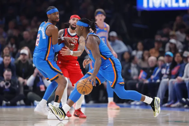 Jan 27, 2026; Oklahoma City, Oklahoma, USA; Oklahoma City Thunder guard Luguentz Dort (5) drives to the basket against the New Orleans Pelicans during the second quarter at Paycom Center. Mandatory Credit: Alonzo Adams-Imagn Images