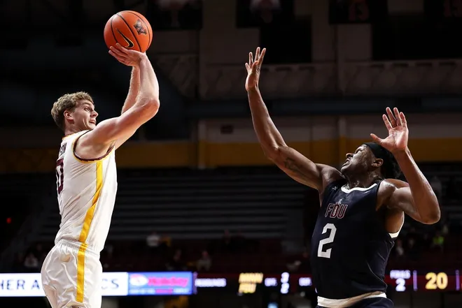 Dec 29, 2025; Minneapolis, Minnesota, USA; Minnesota Golden Gophers forward Cade Tyson (10) shoots the ball over Fairleigh Dickinson Knights forward Taeshaud Jackson (2) during the first half at Williams Arena.