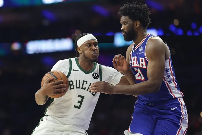 Jan 27, 2026; Philadelphia, Pennsylvania, USA; Milwaukee Bucks center Myles Turner (3) drives against Philadelphia 76ers center Joel Embiid (21) during the first quarter at Xfinity Mobile Arena.